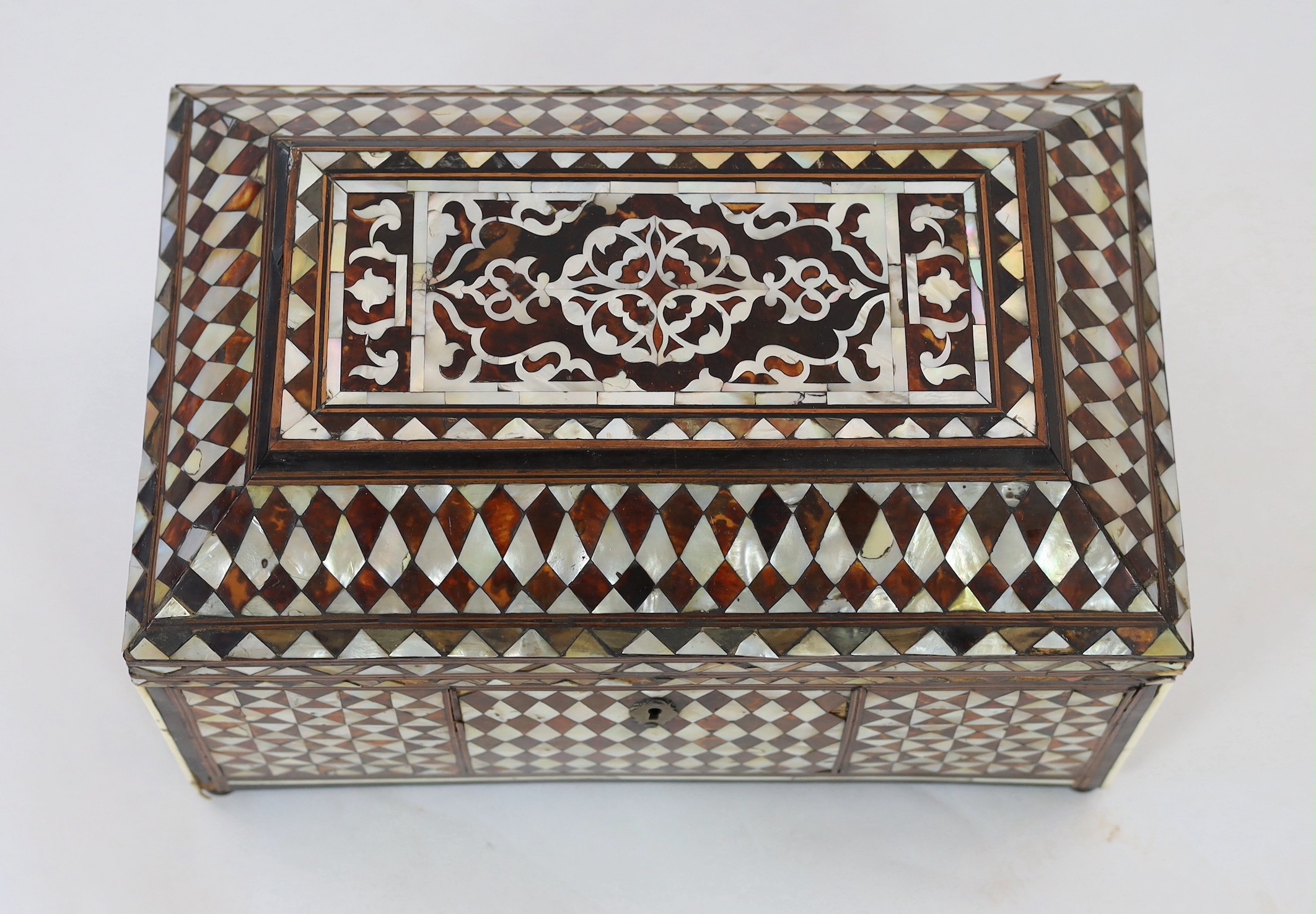 A late 18th/early 19th century Ottoman tortoiseshell and mother-of-pearl scribe’s casket, 49cm wide 30cm deep 31cm high